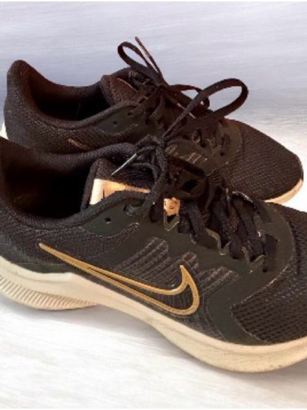 Women’s Nike Black and Gold Running Sneakers
